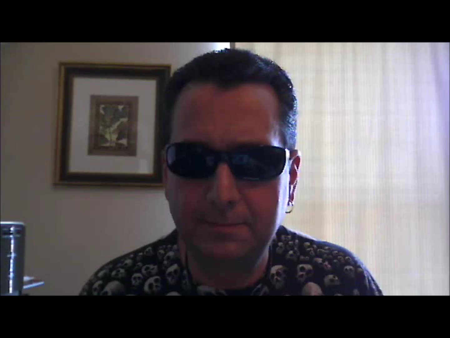A still from a user-made “Cemetery Field Test” video posted to YouTube — a reviewer earnestly demonstrating the Ghost-O-Meter app.