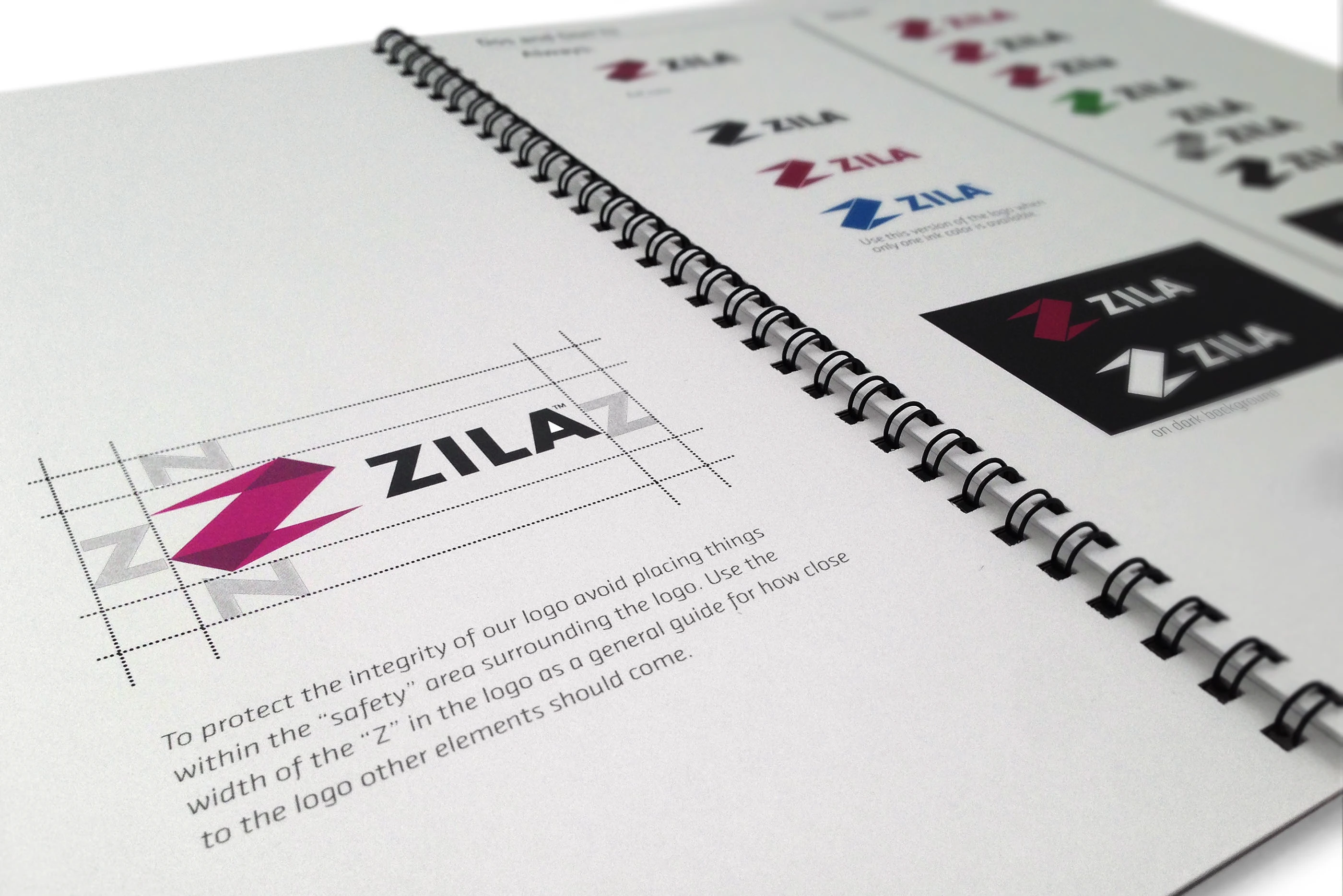 An interior spread of the guidelines showing the logo’s construction and “safety” clear-space rules, alongside approved color and reversed-out logo variations.